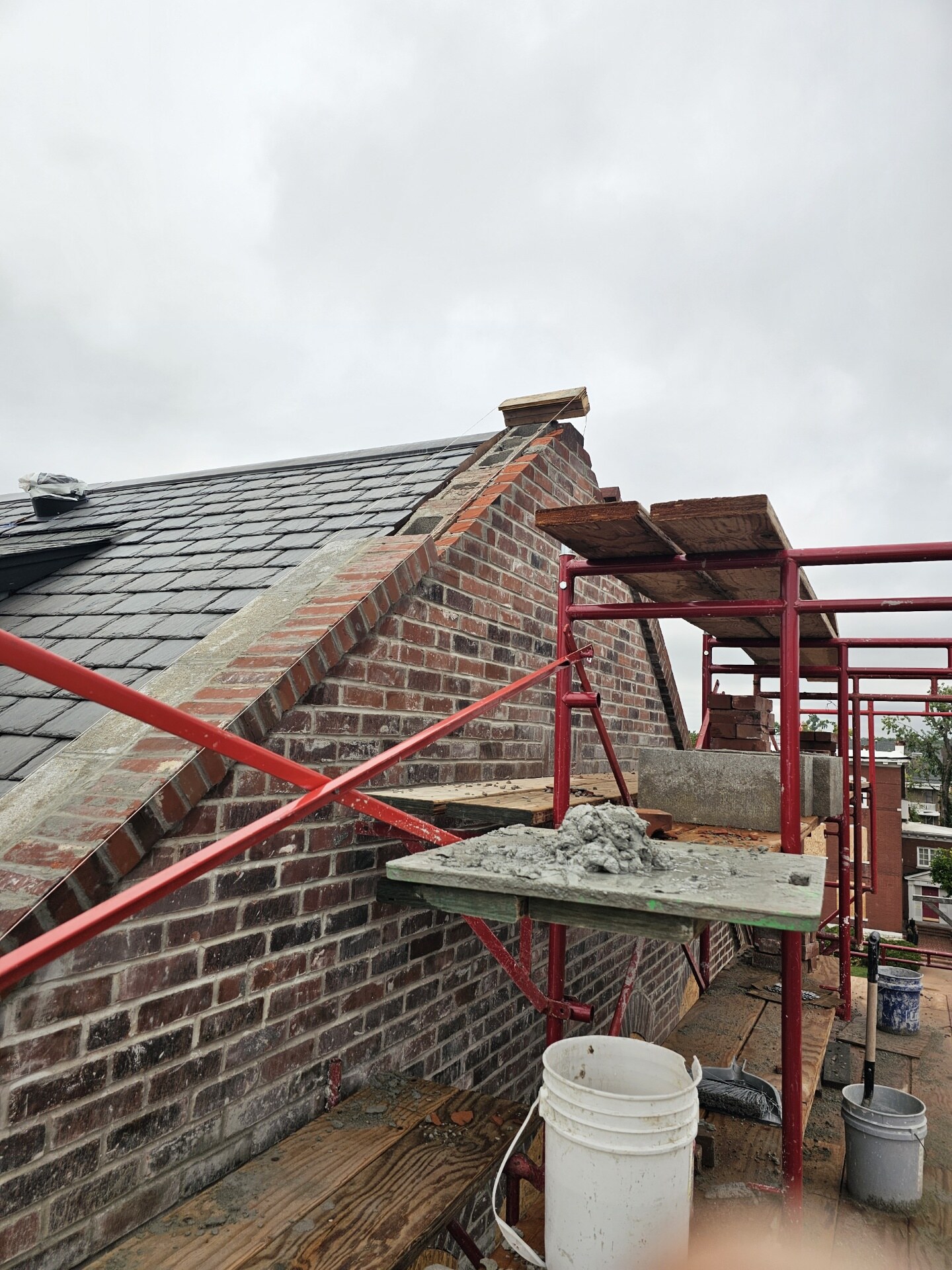 Brick chimney joint restoration in progress