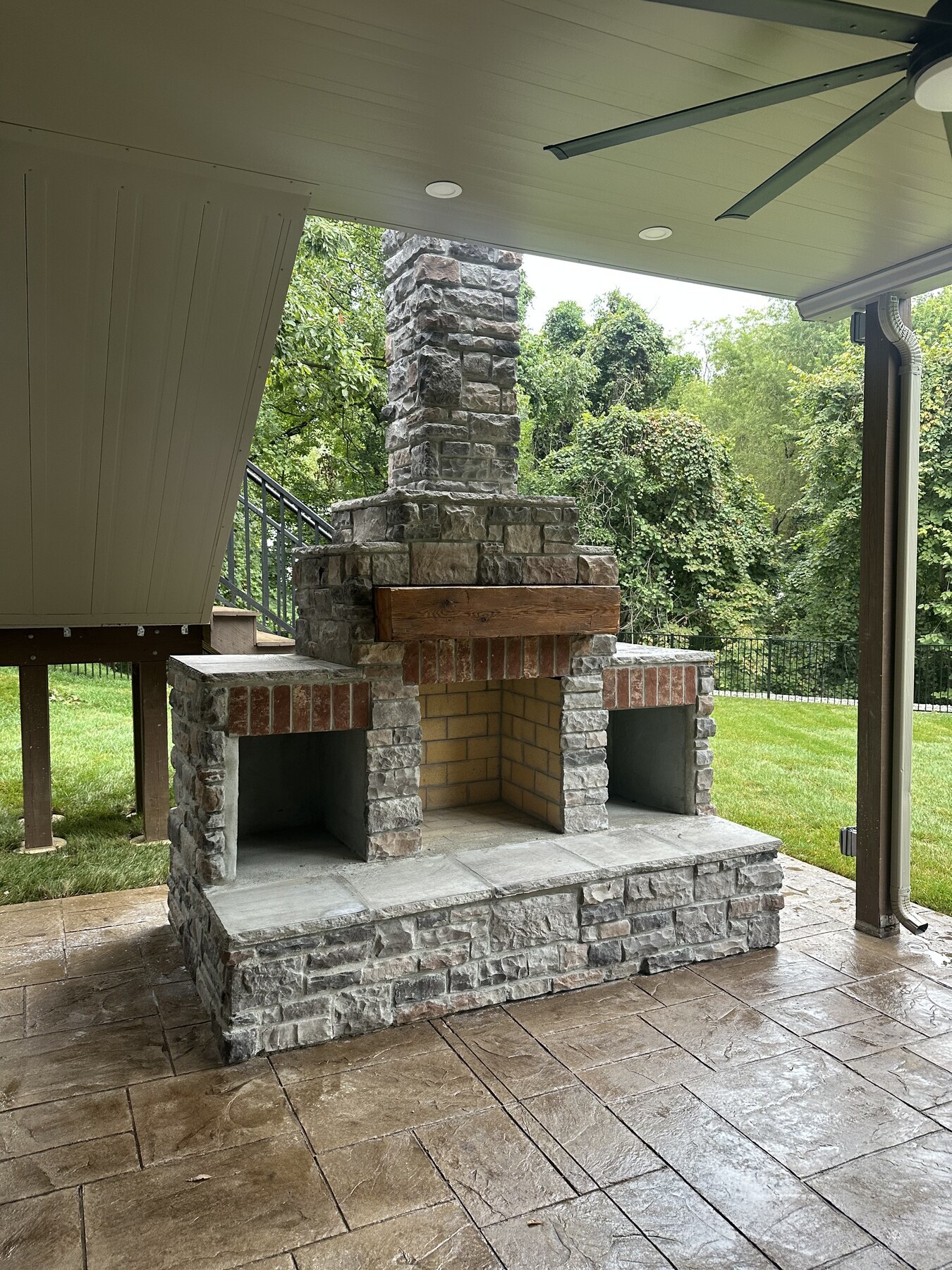 Completed outdoor stone fireplace and masonry hearth