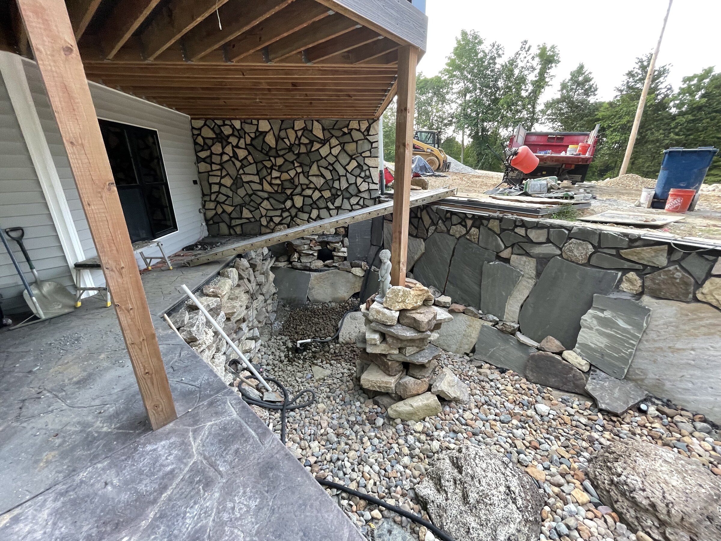 Outdoor stone living area under construction
