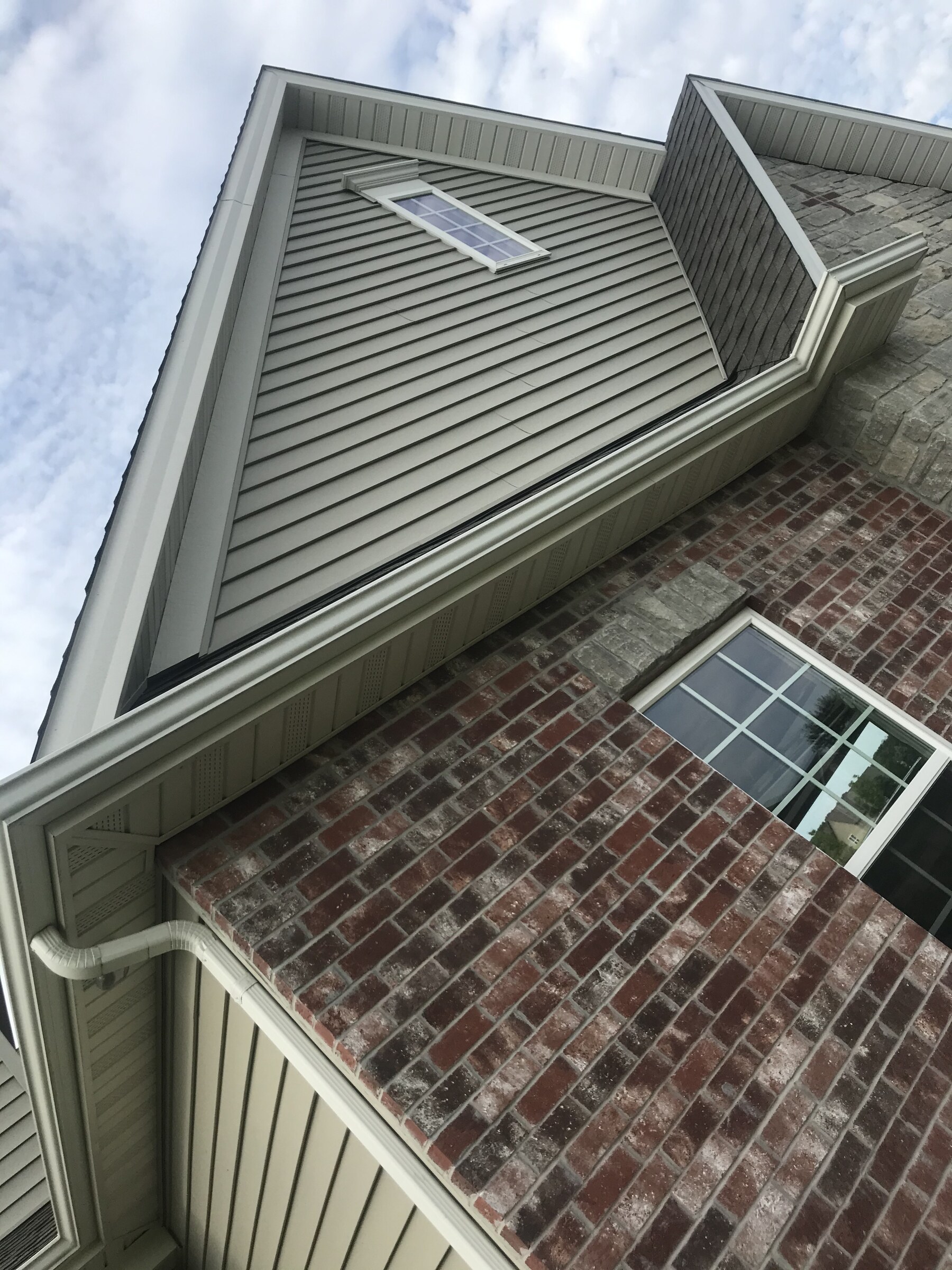 Residential brick and stone gable masonry